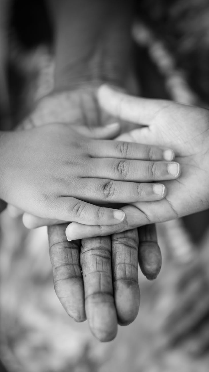 grayscale photo of man woman and child